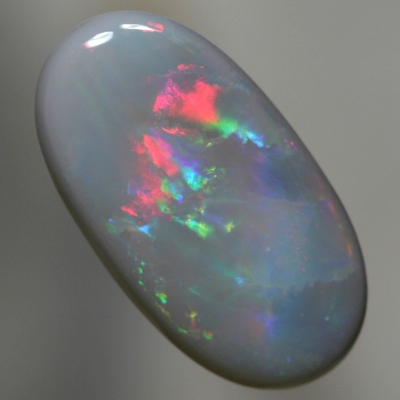SOLID SEMI BLACK OPAL Bright reds to peacock fire with gold